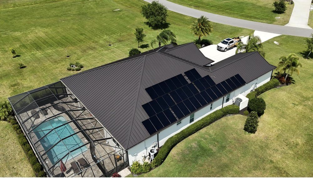 Metal roof replacement with solar panels by Hunter Construction